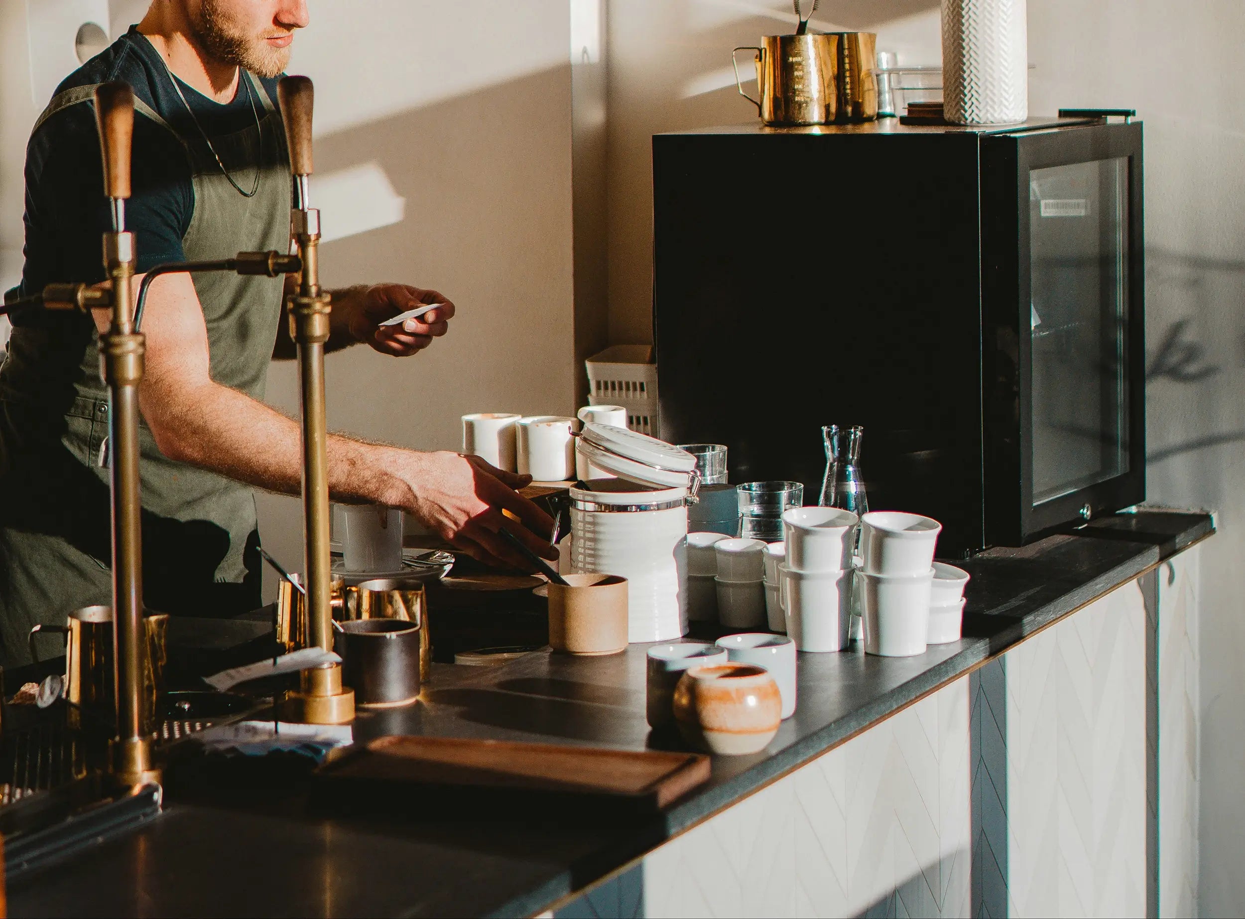barista using coffee equipment